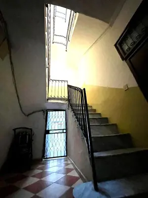 a stairway with a window and a stair case at NONNA MARI' in Palermo