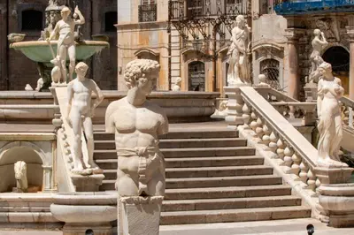 a statue of a man standing in front of a fountain at NONNA MARI' in Palermo