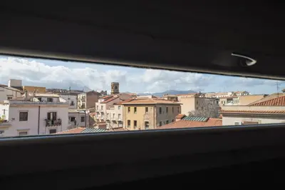 a view of a city from a window at La Cala Terrace by Domusicily in Palermo