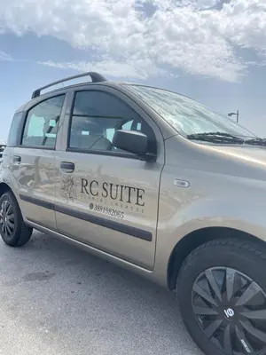 a white truck parked in a parking lot at RC SUITE TERMINI IMERESE in Termini Imerese