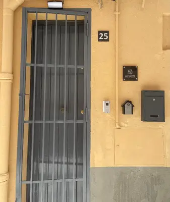 a door to a building with a sign on it at RC SUITE TERMINI IMERESE in Termini Imerese