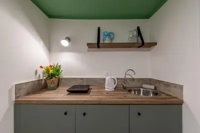 a kitchen with a sink and a counter top at Holiday Home GaribaldiOM Palermo Centro Storico! in Palermo