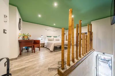a bedroom with a bed and a desk in a room at Holiday Home GaribaldiOM Palermo Centro Storico! in Palermo