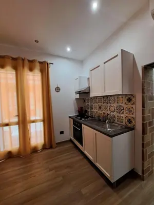 a kitchen with a sink and a stove top oven at Colle del Re Sicily in Partinico
