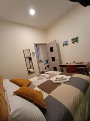 a bedroom with a bed with towels on it at Room Sixty One in Palermo