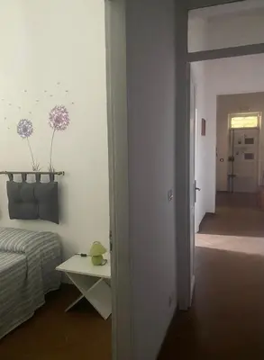 a living room with a couch and a table in a room at Casa di Vale in Palermo