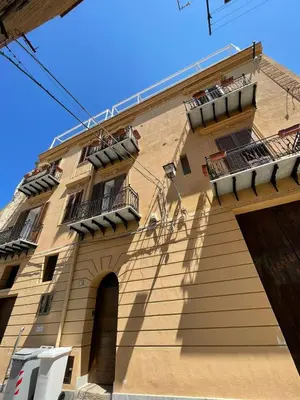 a building with balconies on the side of it at La Baronessa in Palermo