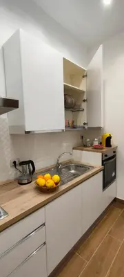 a kitchen with a bowl of oranges on the counter at PortoAmuri in Palermo