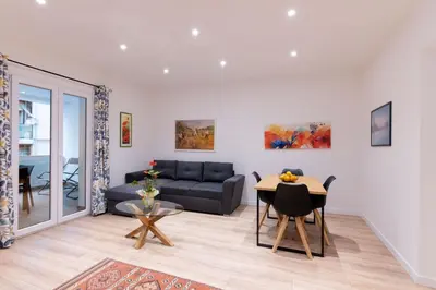 a living room with a couch and a table at SarAle Apartments in Palermo