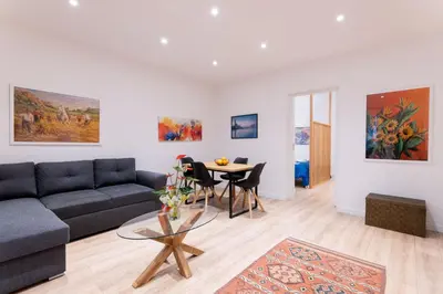 a living room with a couch and a table at SarAle Apartments in Palermo