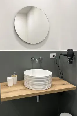 a bathroom counter with a sink and a mirror at Dimora Borghese “Whitaker” in Palermo