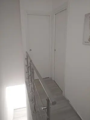 a staircase in a white room with white walls at Casa vacanze Venere in Balestrate