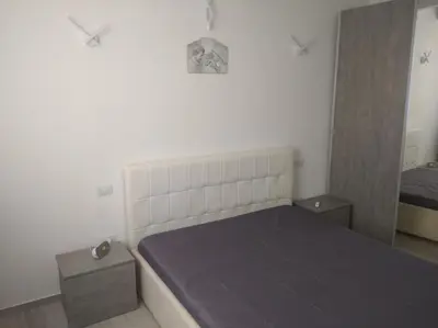 a small bedroom with a bed and a mirror at Casa vacanze Venere in Balestrate