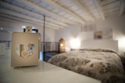 a bedroom with a large bed in a room at Casa dei Principi di Belvedere in Palermo