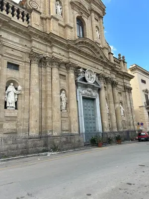 a building with a clock on the front of it at La Kalsa di Somavi in Palermo