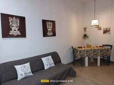 a living room with a couch and a table at 'A Sicula in Palermo