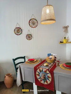 a dining room with a table with food on it at 'A Sicula in Palermo