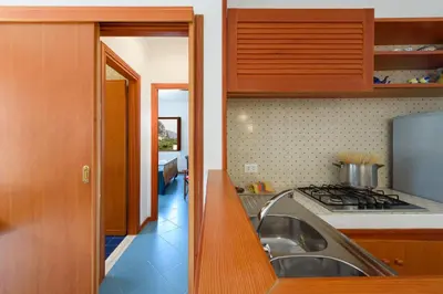 a kitchen with a sink and a stove at Casa ChiaraMarina in Macari