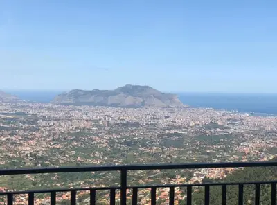 a view of a city with a mountain in the background at IL PANORAMA in Altofonte