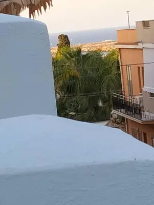 a pile of snow on the roof of a building at Dammuso SoleLuna. in Terrasini