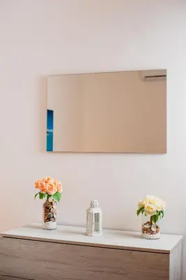 a bathroom with two vases with flowers on a shelf at VILLA HEMINGWAY - LA Casa di Alessia e La Casa di Leonardo in Ficarazzi