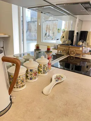 a counter with four dishes and a spoon on a table at Bella Vita Palermo in Palermo