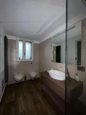 a bathroom with two sinks and a tub and a mirror at Prince Suite Palermo in Palermo
