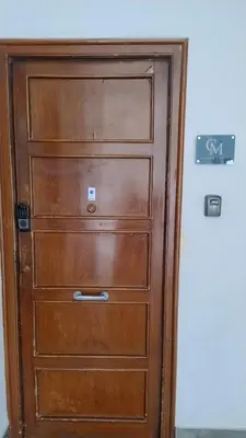 a wooden cabinet with four drawers in a room at LE CAMERE DI VIA MECCIO in Palermo