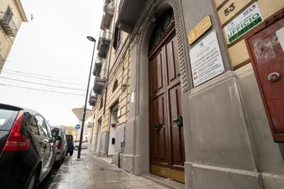 a building with a door on the side of a street at B&B Handy Palermo in Palermo