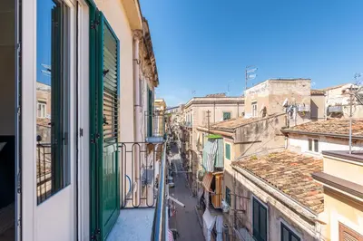 a view of a city street from a window at Porta di Castro Design Apartment with Terrace by Wonderful Italy in Palermo
