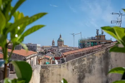 a view of a city from atop a wall at Porta di Castro Design Apartment with Terrace by Wonderful Italy in Palermo