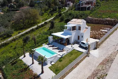 an aerial view of a house with a swimming pool at Villa Bellacosa con Piscina Privata vista mare in Castellammare del Golfo