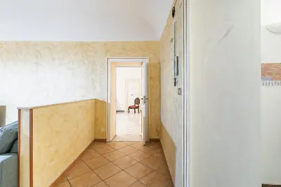 a hallway with a door leading to a room at Piazza Pretoria & Quattro Canti Roomy Flats with Balconies in Palermo