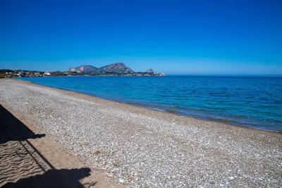 a shadow of a person on the beach at Sea Air - Aria di Mare in Casteldaccia