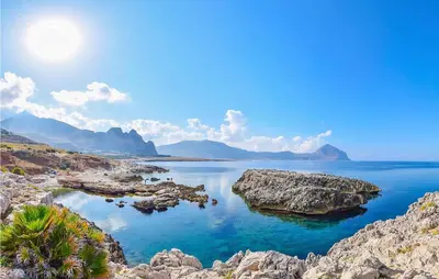 a view of a body of water with rocks at Nice Home In Balestrate in Balestrate
