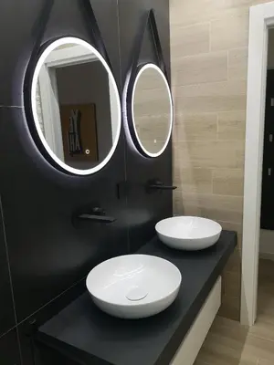 two sinks in a bathroom with two mirrors at LA CASA DI TIAGO in Palermo