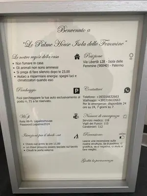 a picture of a menu in a white frame at Le Palme House Isola delle Femmine in Isola delle Femmine