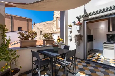 a bedroom with two beds with yellow pillows at Pomodoro House allo Spasimo by Wonderful Italy in Palermo