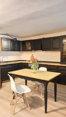 a kitchen with a table and two chairs and a table at Pia's Home in pieno centro storico in Palermo