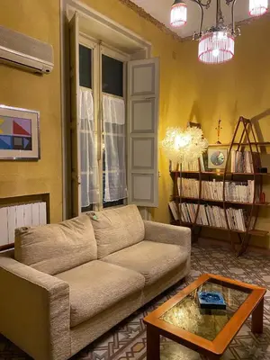 a living room with a couch and a coffee table at Amari 106 in Palermo