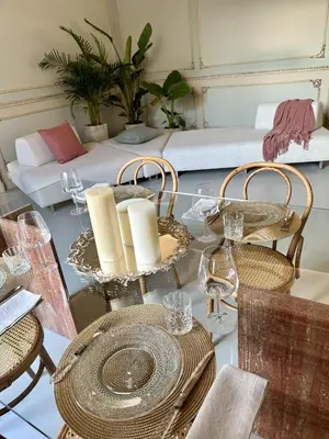 a dining room with tables and chairs and a couch at Casa Guilla_alla Cattedrale in Palermo