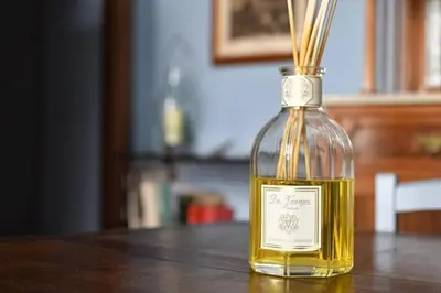 a bottle of oil sitting on a wooden table at iFlat agli Archetti del centro in Palermo
